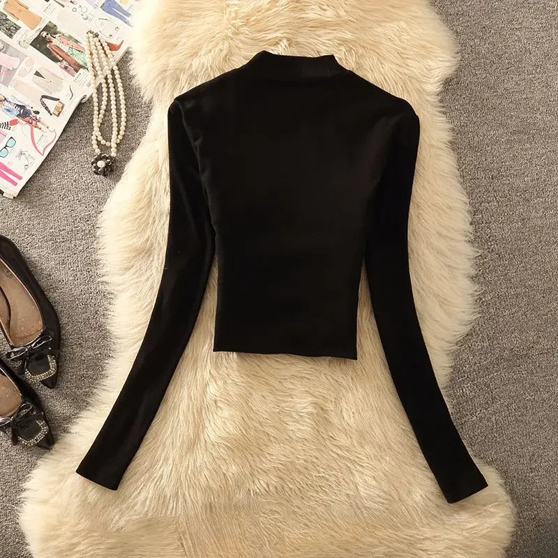 Top elegante de manga larga único de cuello alto para muj...
