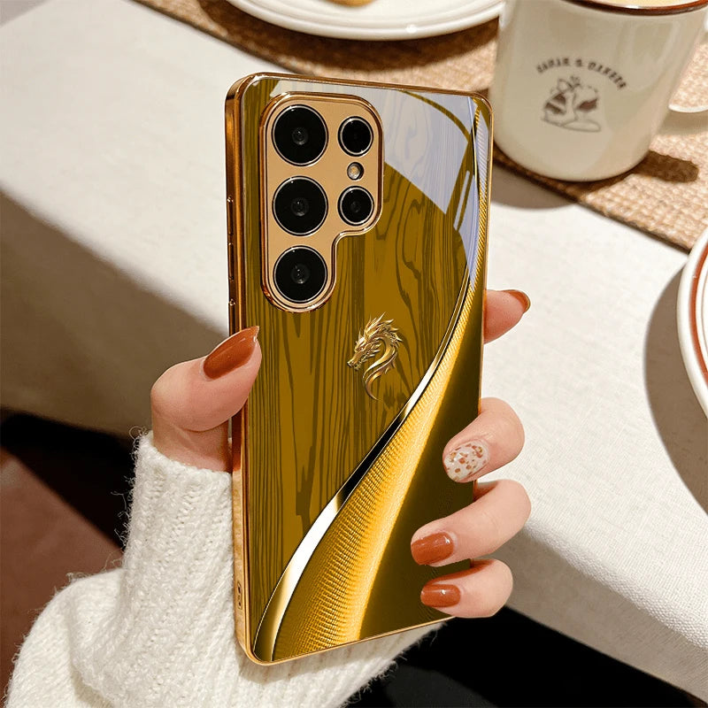 Gold galvanized phone case featuring a dragon design, designed to protect and decorate smartphones with intricate detailing.