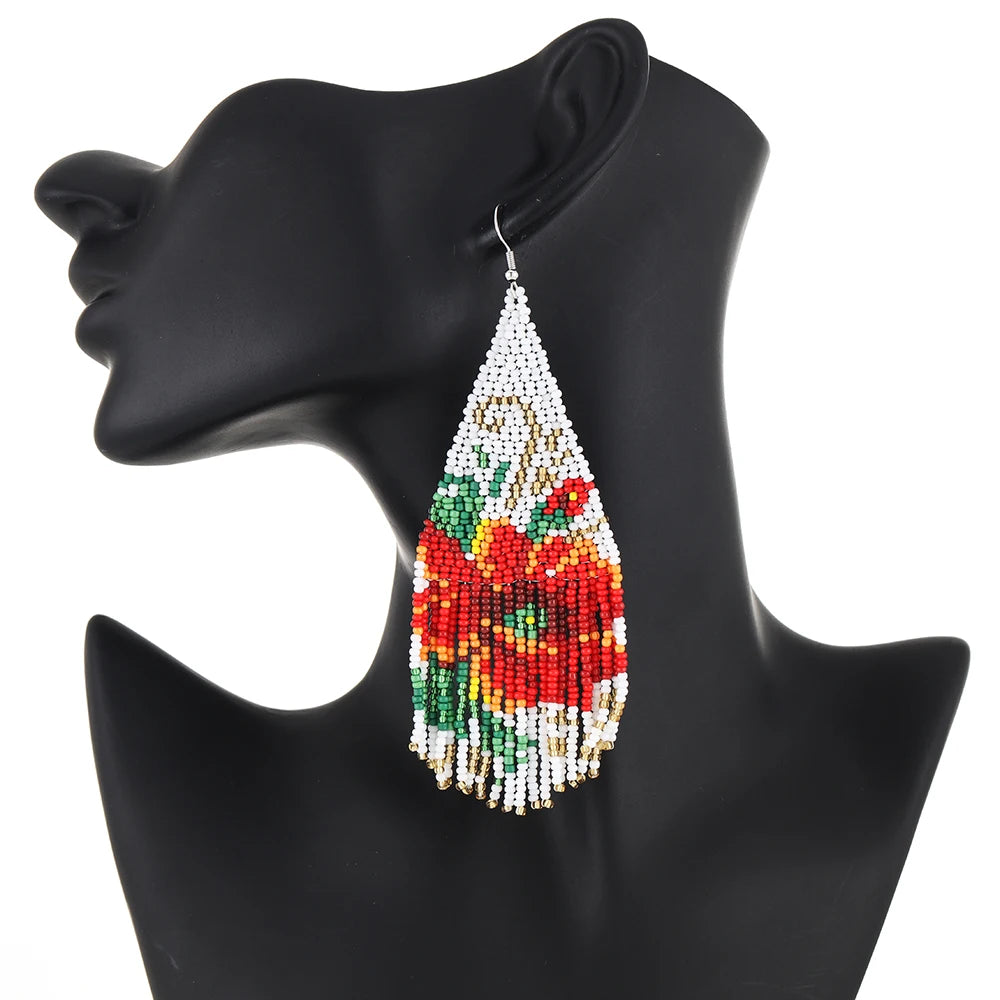 Bohemian style 3D tassel earrings by Corporación Turística, featuring colorful layered design with hanging fringe details.
