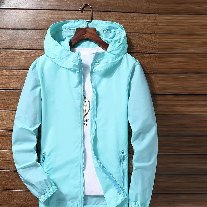 Quick-dry cycling and running jacket by Corporación Turística, lightweight waterproof protector for active outdoor sports.