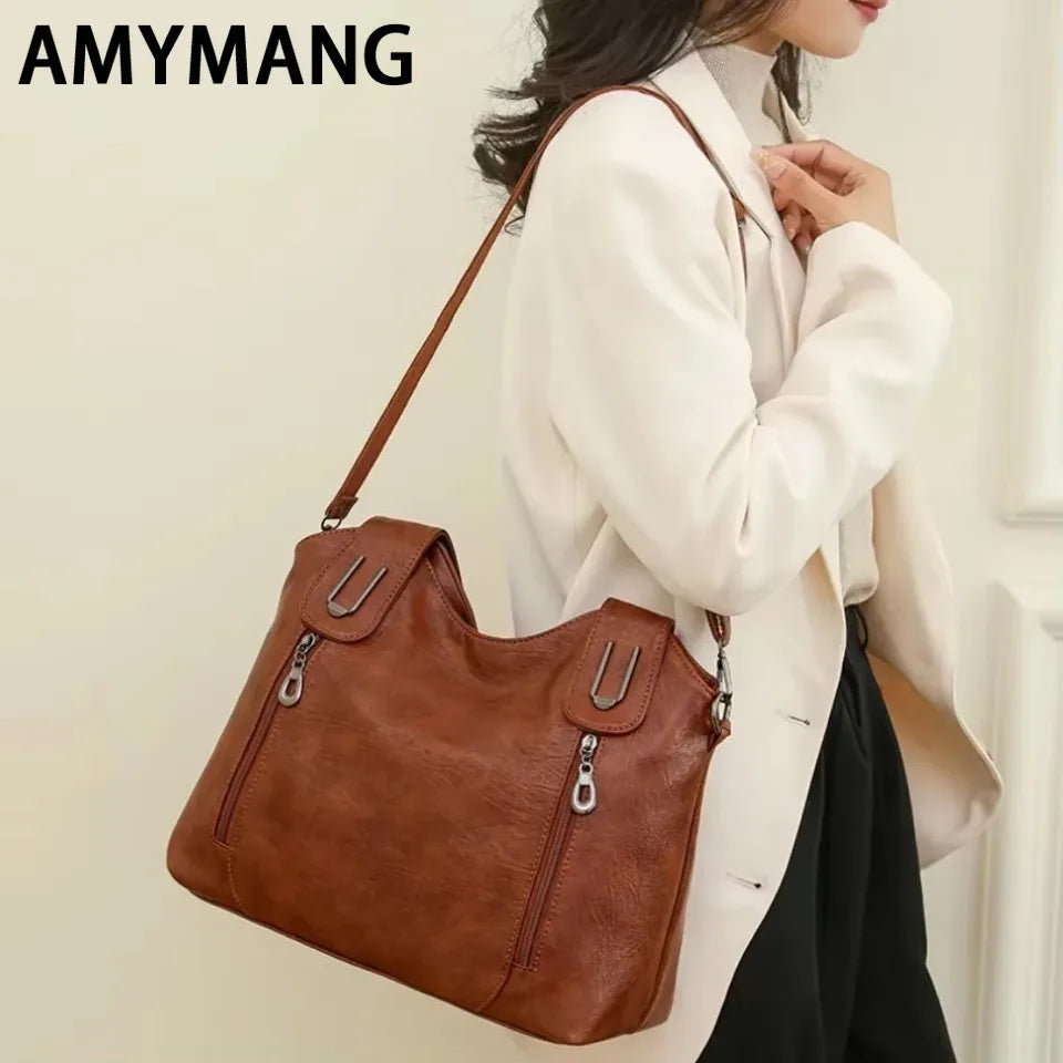 Solid color fashionable women's handbag from Corporación Turística, stylish and compact for everyday use.