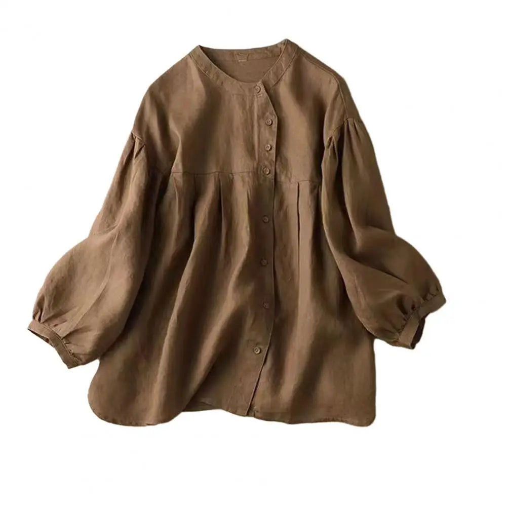 Light beige retro women's blouse with puff sleeve, loose fit, and vintage-inspired design by Corporación Turística.