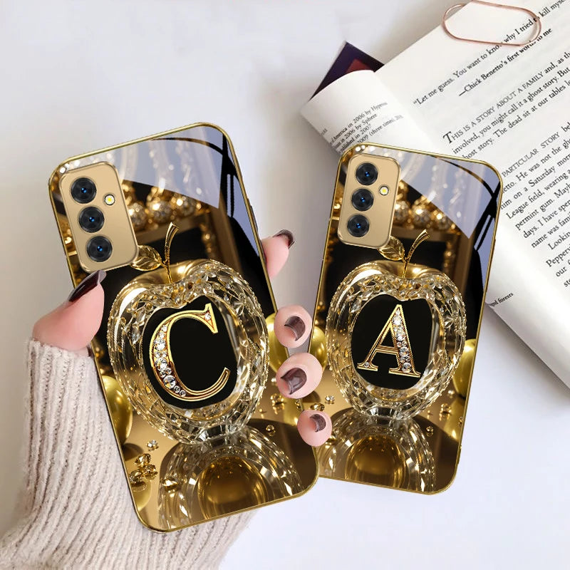 Golden crystal phone case with letter 'A' from Corporación Turística, featuring a shiny, elegant design for smartphones.