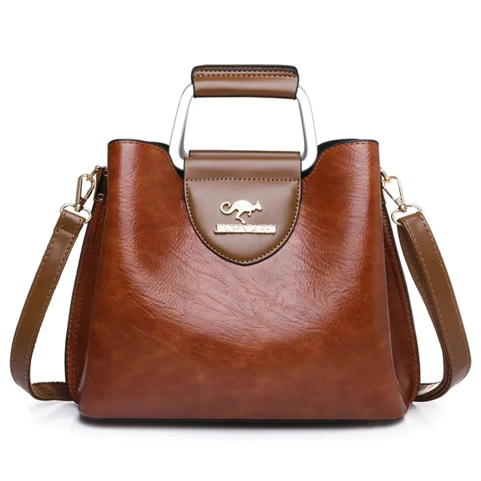 Genuine leather women's handbag by Corporación Turística, stylish and compact with top handle and smooth leather finish.