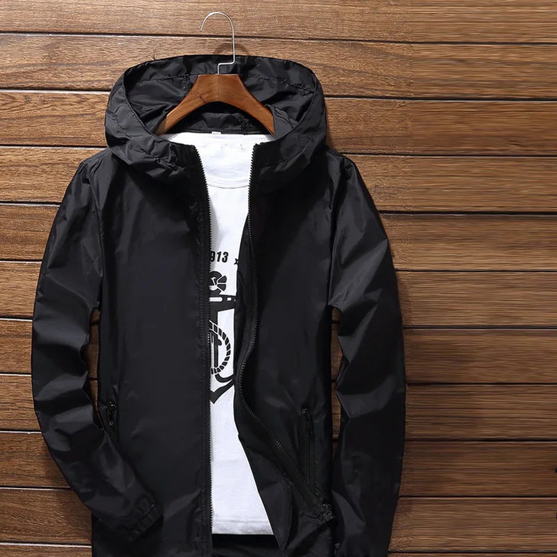 Quick-dry cycling and running jacket by Corporación Turística, lightweight waterproof protector with breathable fabric.