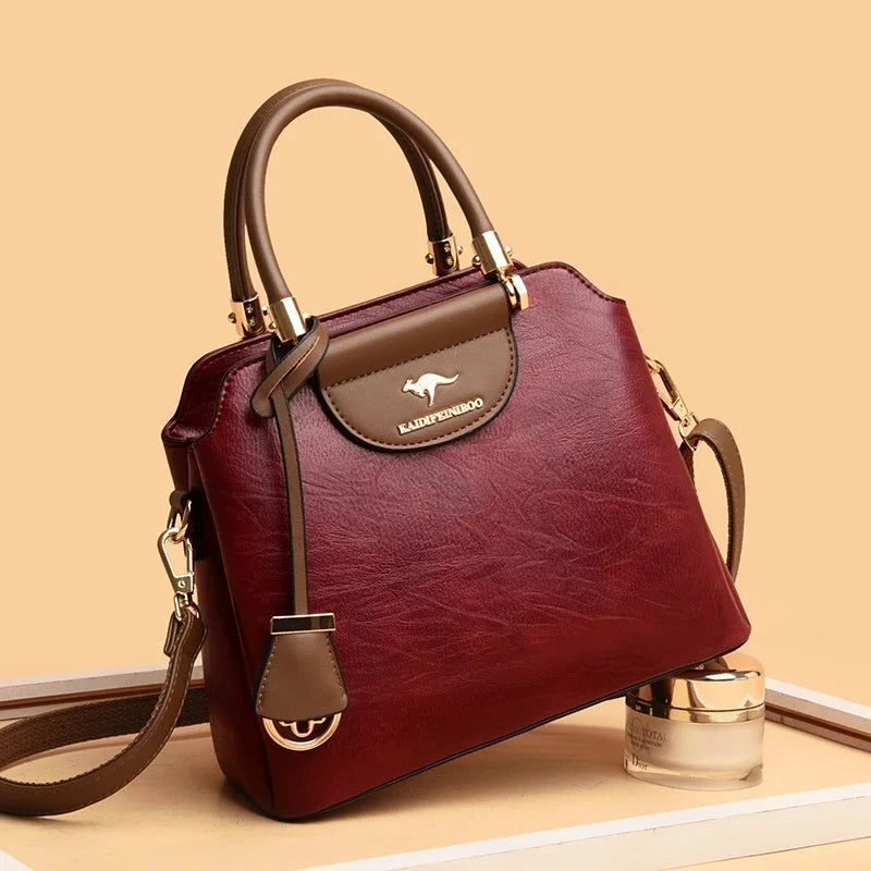 Small women's leather crossbody bag with shoulder strap, stylish and compact for everyday use.