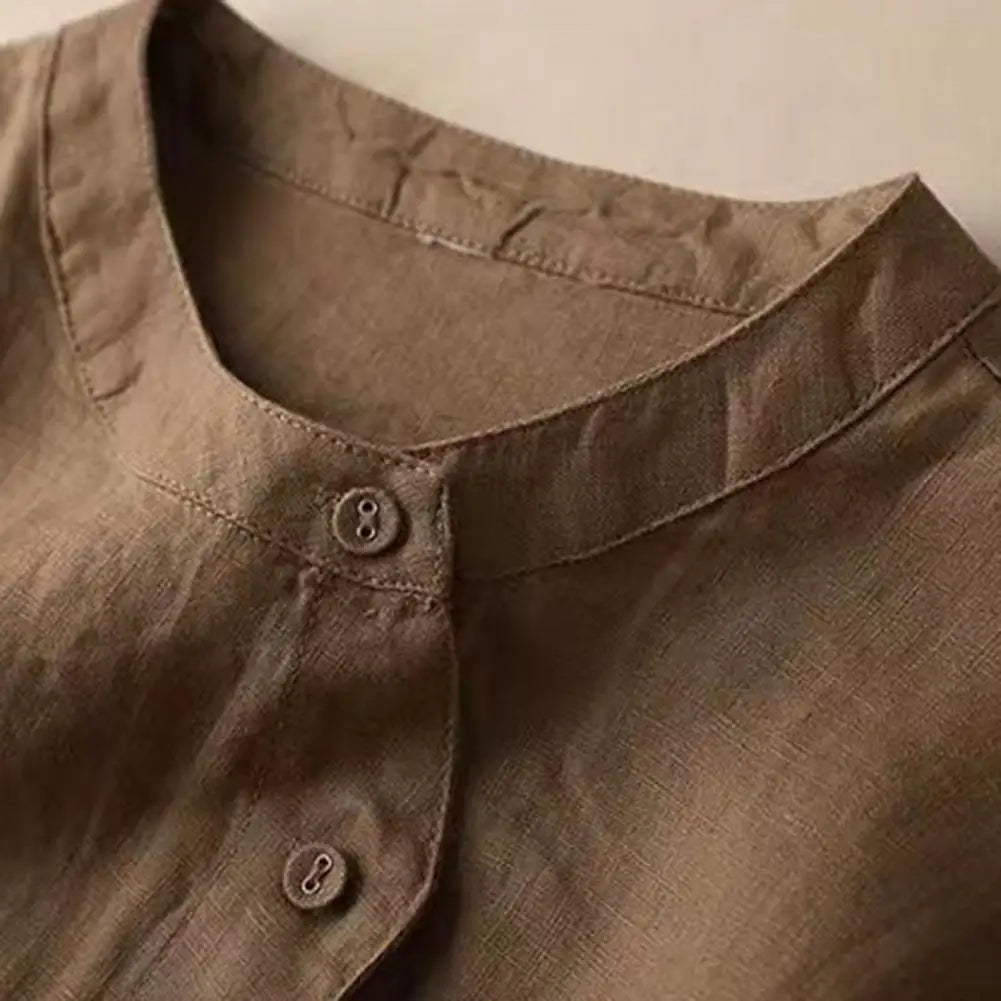 Loose-fitting retro women's blouse with balloon sleeves, stylish casual top by Corporación Turística.