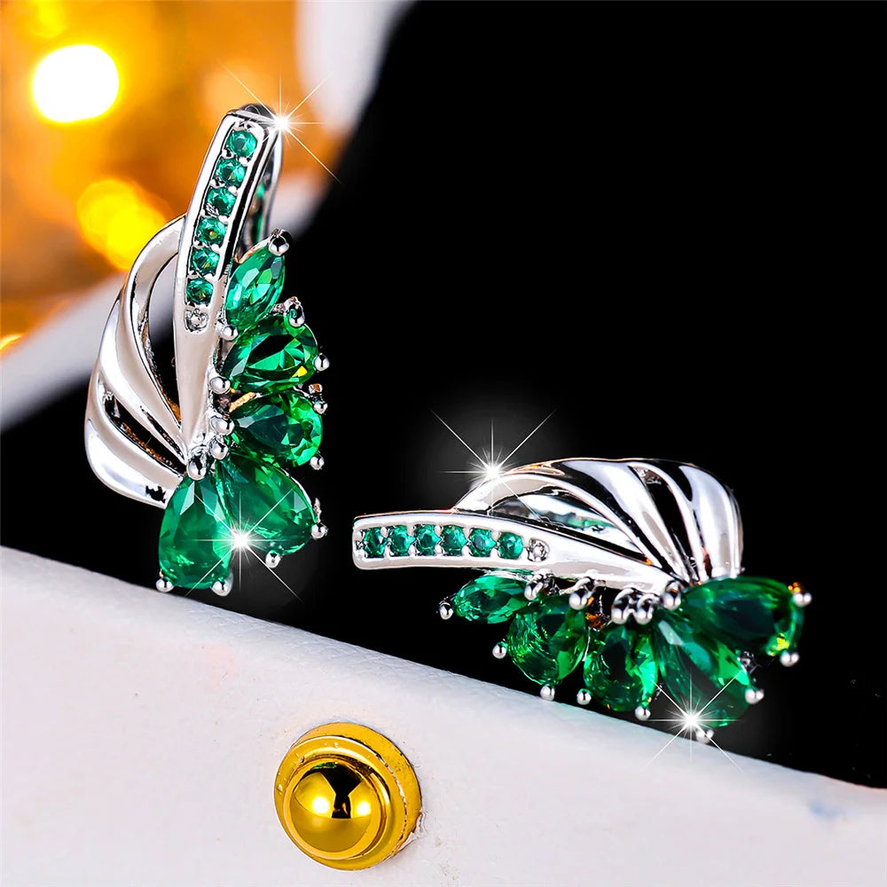 Luxury clip-on earrings with green and blue stones for women, featuring elegant design and vibrant gemstone accents.