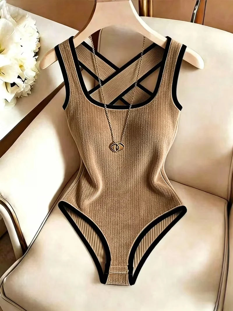 Cream-colored sleeveless ribbed knit body for women with open back, by Corporación Turística, shown on a model.