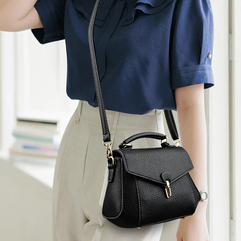Small high-quality women's crossbody bag from Corporación Turística featuring a sleek design and durable strap.