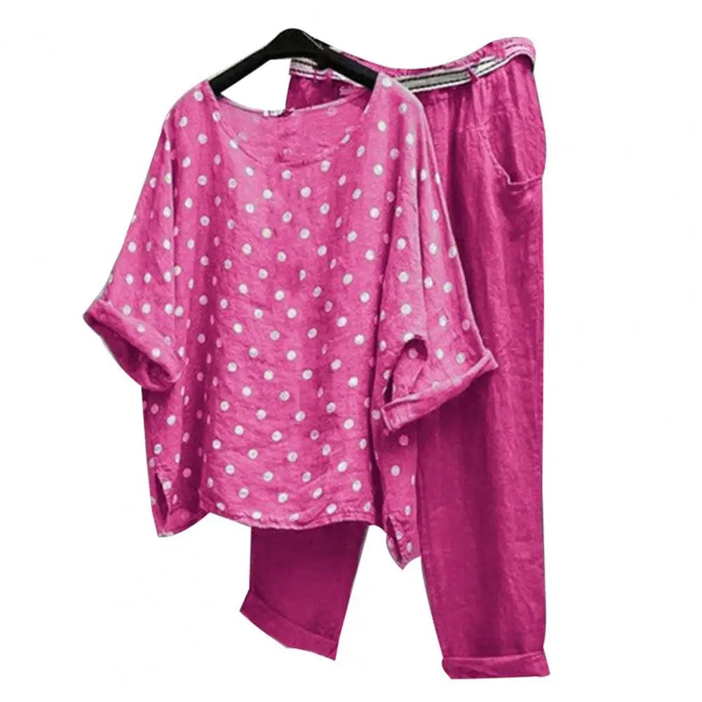 Spring summer women's outfit with blouse and pants from Corporación Turística, displayed in a stylish, vibrant fashion ensemble.