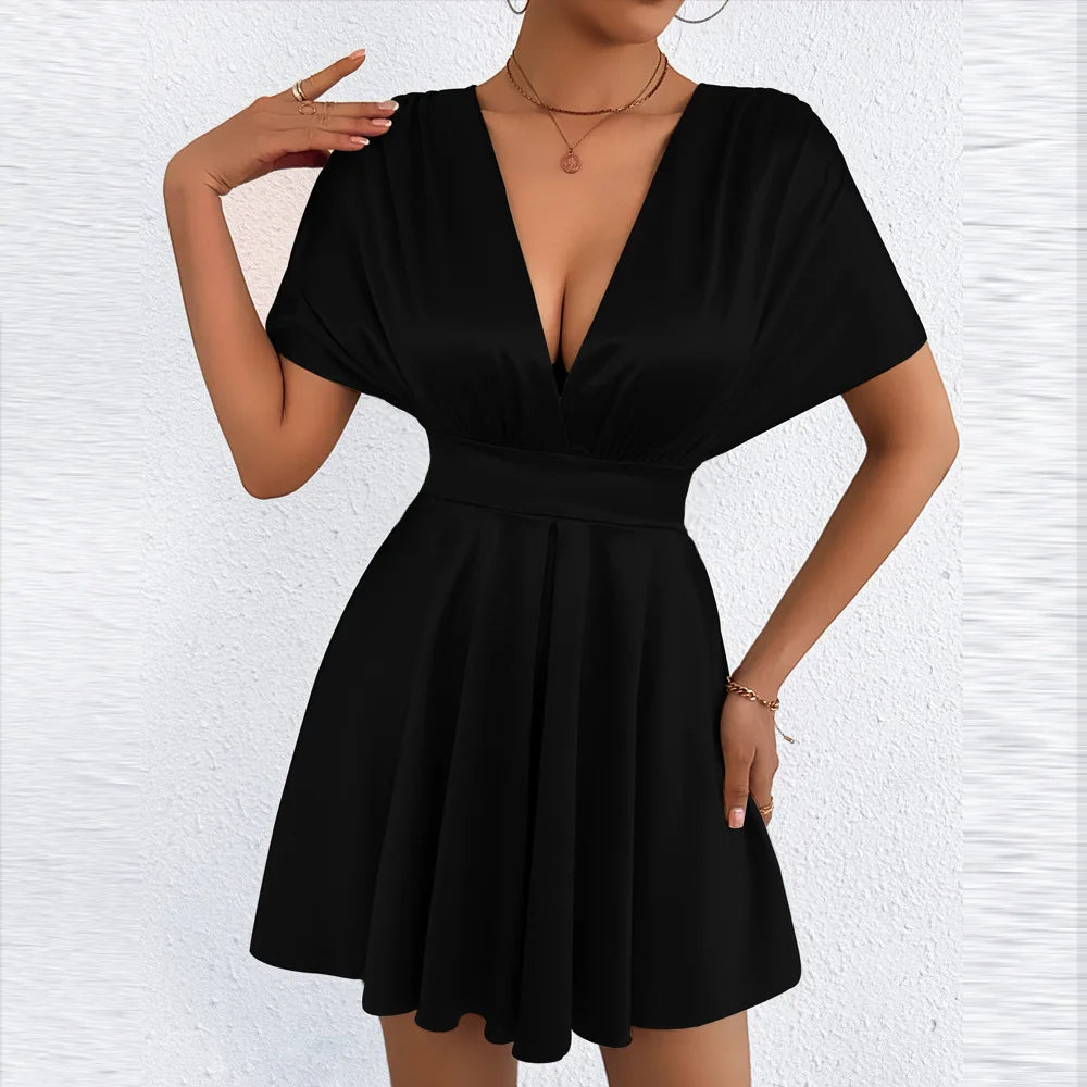 Elegant sexy dress with deep V neckline and low waist, featuring sleek design and stylish fit, by Corporación Turística.
