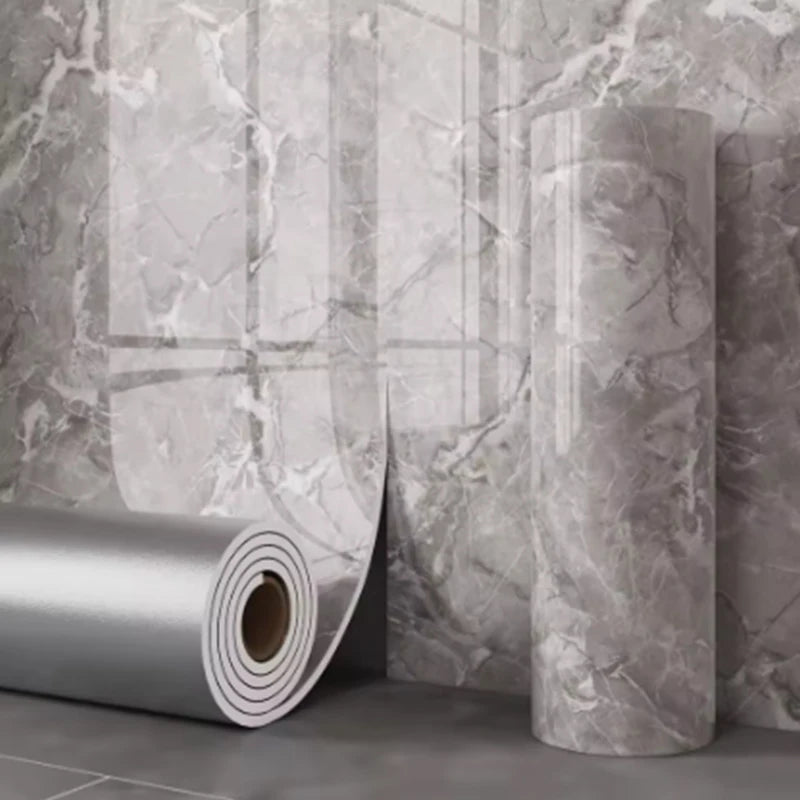 Thick foam marble wallpaper roll from Corporación Turística, showing textured gray and white marble pattern for wall decor.